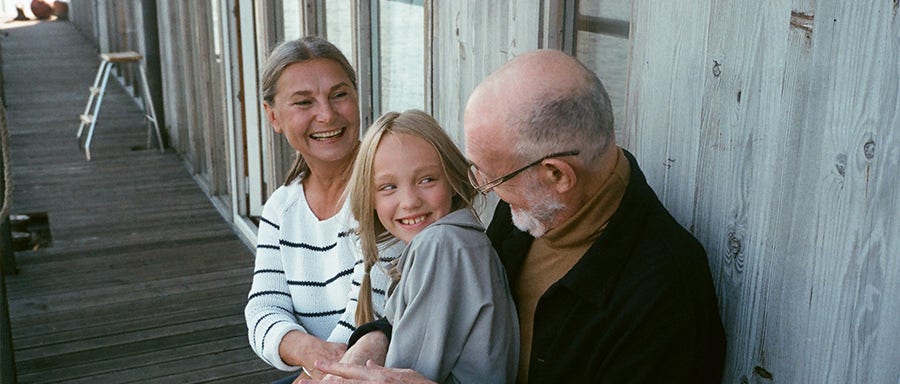 Couple smiling with their kid