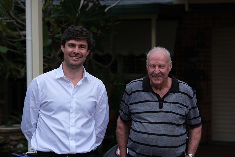Maurice Blackburn lawyer Liam with client Graham standing side by side.