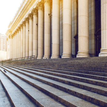 Exterior view of the steps and pillars outside a court house 