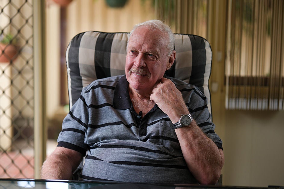 Maurice Blackburn client Graham sitting on an armchair.