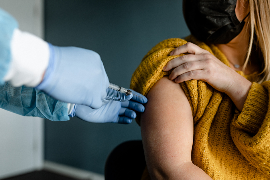 A woman getting a COVID-19 vaccine