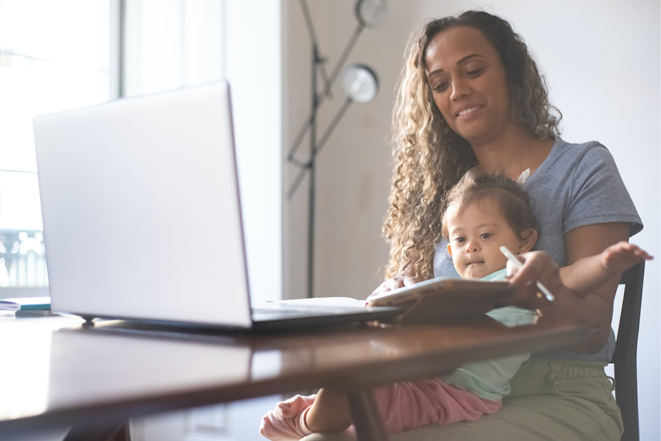 A mum working from home and caring for her daughter at the same time