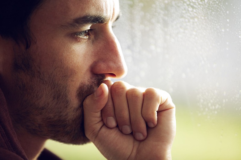 A contemplative man in side profile