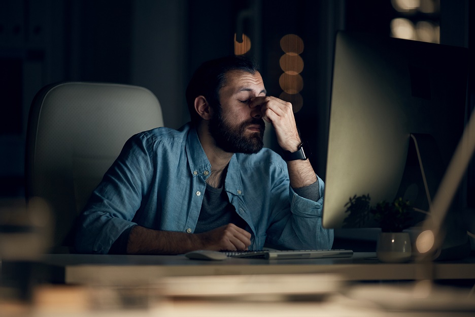 Employee working late from home experiencing poor mental health