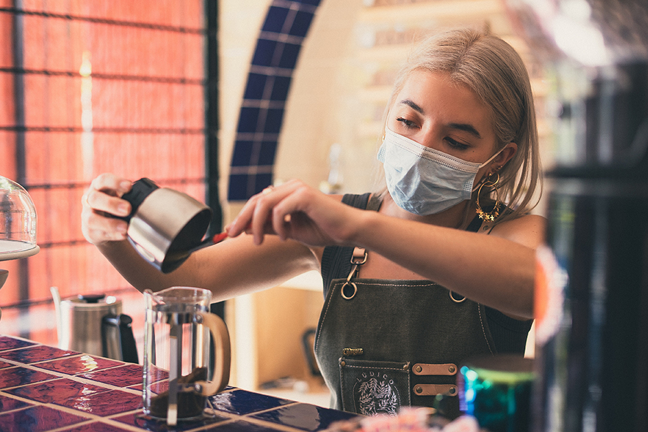 A woman working in a coffee shop