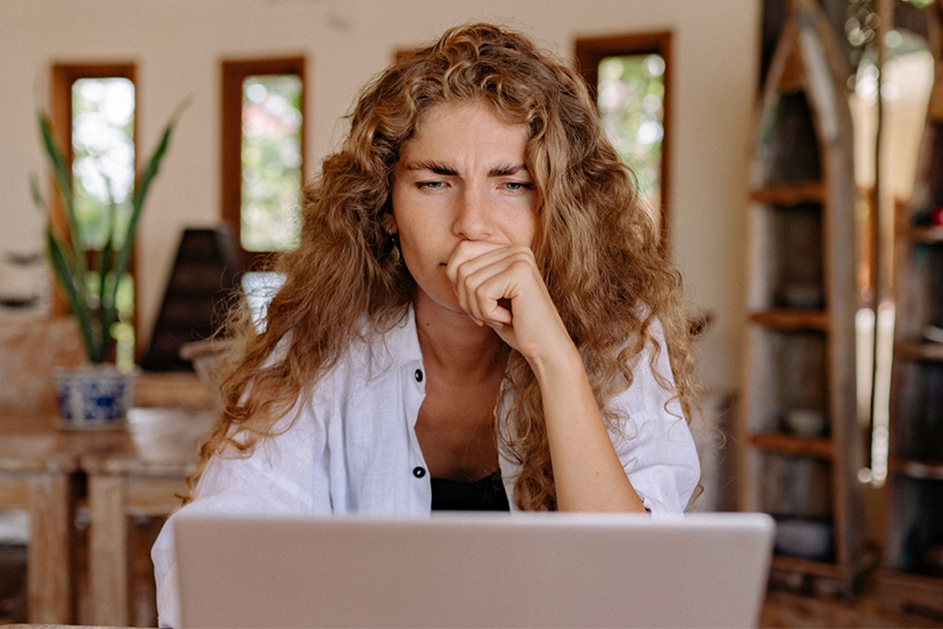 Contemplative will disputes client looking at her laptop 