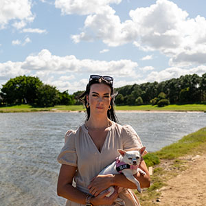 Maurice Blackburn client Alainas with her dog by the lake