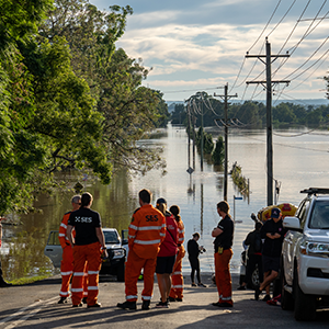 SES volunteers on the scene of a flooded road in Queensland