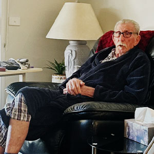 Maurice Blackburn client Ivan Tabbitt (Lofty) sitting in an armchair.