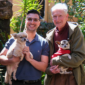 Maurice Blackburn lawyer Ross with client Tony with his two dogs.