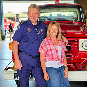 Maurice Blackburn client Simon with his wife standing in front of the car.