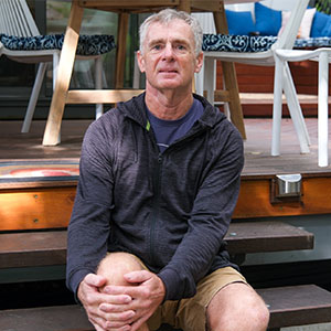 Maurice Blackburn client Richard sitting, looking at the camera.